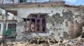 A man stands inside a house damaged after cross border shelling by Pakistan, during the ongoing military conflict between India and Pakistan, at Behra village of Mendhar sector, in Poonch district, Jammu and Kashmir, Saturday. (PTI Photo)
