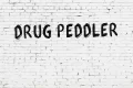 inscription-drug-peddler-written-black